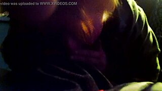 Interracial blowjob video featuring a milf performing oral sex on a large cock in detailed close-up.