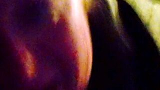 Interracial blowjob video featuring a milf performing oral sex on a large cock in detailed close-up.
