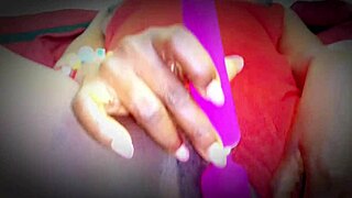 college ebony girl relaxes in red lingerie chair