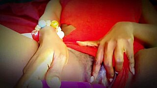 college ebony girl relaxes in red lingerie chair