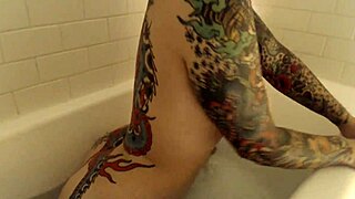 Tattooed girl in her final bath show