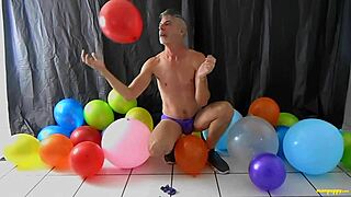 I love balloon play with my monster cock as a horny gay dilf.