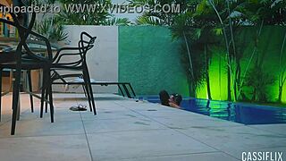 Couple enjoys a party at the pool with friends