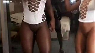 Two hot black babes dance and flash their wet pussies on New Year's!