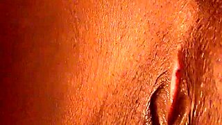 i am playing with my pretty ebony pussy in close up