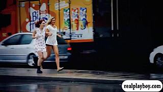 Two attractive babes using a blue dildo together