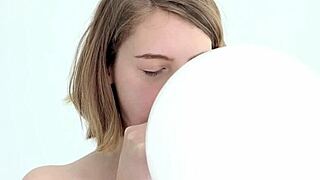 watch this young babe blow and pop her first balloon while giving a blowjob