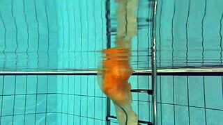 Nastya strips and shows her naked body in the pool