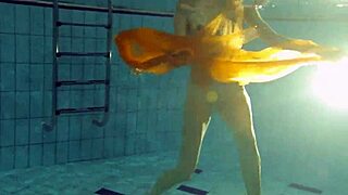 Nastya strips and shows her naked body in the pool